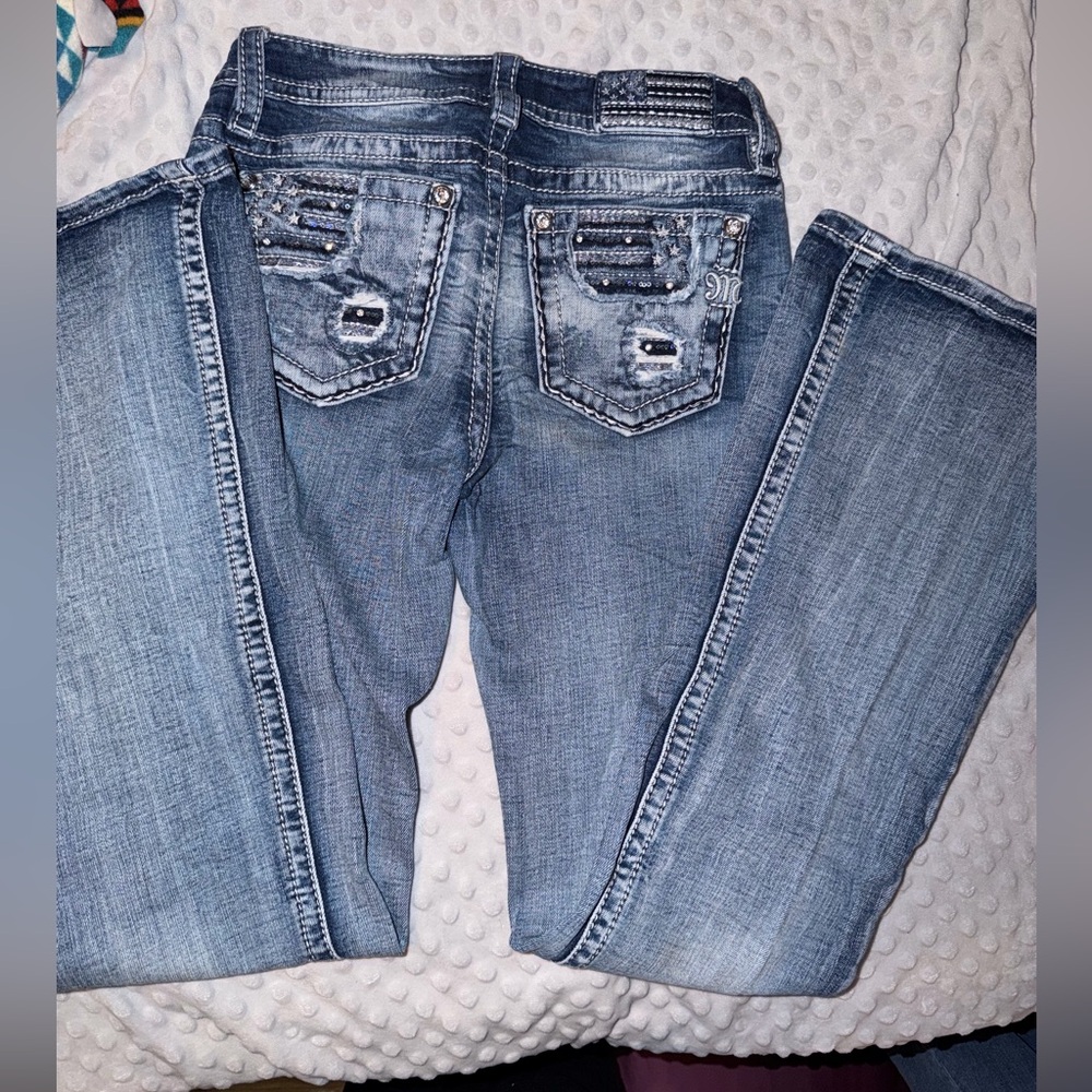 Woman’s Miss Me Mid-Rise Flare Jeans